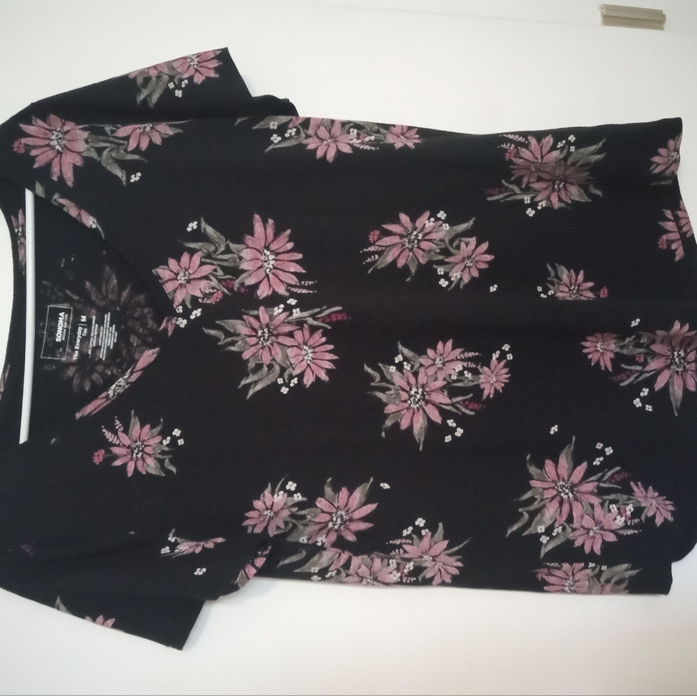 Blacktop with purple flowers